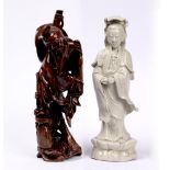 Carved wood sage Chinese 32cm high and a blanc de chine model of Guanyin, 31.5cm high, (2).