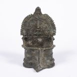 Bronze oil burner Nepal, 19th Century with a central deity to the centre, the bottom well modelled