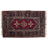 Doshmelolta rug Turkish with three central star motifs within a triple foliate and geometric border,