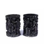 Pair of relief carved brush pots Chinese, 19th Century in black stained hardwood, 20.5cm high