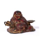 Painted metal seated Putai Chinese, 19th Century the figure holding a fan in his right hand and bowl
