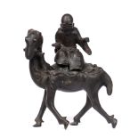 Bronze model of a lohan on a deer Chinese, 19th Century the removeable figure holding a scroll in