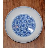 Blue and white dish Chinese decorated to the interior with a central roundel depicting floral