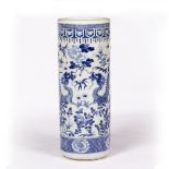 Blue and white porcelain stick stand Chinese, 19th Century painted with a dragon and peonies, within