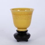 Yellow glazed cup Chinese with incised decoration around the neck of the cup, six character mark