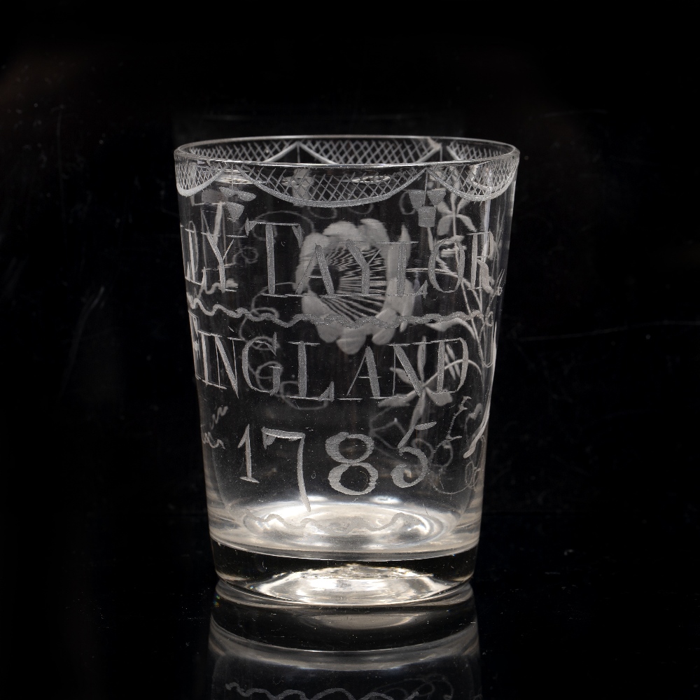 AN 18TH CENTURY TUMBLER engraved 'MOLLY TAYLOR FINGLAND 1785' with a pattern border, 10cm high