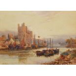 STUART LLOYD (1845-1959) Caernarfon Castle with fishing vessels in the foreground, signed,