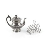 A GEORGE IV SILVER PLATED COFFEE POT, with half lobed body, gadrooned border and wooden handle, 21.