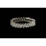 A DIAMOND FULL HOOP ETERNITY RING, claw set throughout with marquise-cut diamonds, white precious