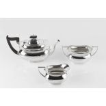 A SILVER THREE PIECE TEA SERVICE, the teapot with ebonised handle and knop, by Walter & Hall,
