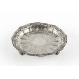 AN EDWARDIAN SILVER GILT CIRCULAR DISH, with scallop and foliate scroll cast border, engraved with