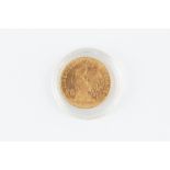 A GOLD 20 FRANCS COIN, dated 1910