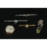 AN EMERALD AND DIAMOND BAR BROOCH, the rectangular step-cut emerald in millegrain collet setting, to