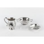 AN EARLY VICTORIAN SILVER BALUSTER MUG, embossed with scrolling foliage and having scroll handle, by