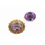 A 19TH CENTURY AMETHYST PANEL BROOCH, circa 1820-30, the oval mixed-cut amethyst bordered by