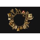 A CHARM BRACELET, the belcher-link bracelet stamped '9 375', suspending a collection of assorted 9ct