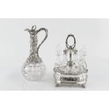 A VICTORIAN CUT GLASS CLARET JUG with silver plated mounts, foliate cast and engraved with