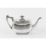 A GEORGE III SILVER TEAPOT, the rounded rectangular body with a band of reeded decoration, on ball