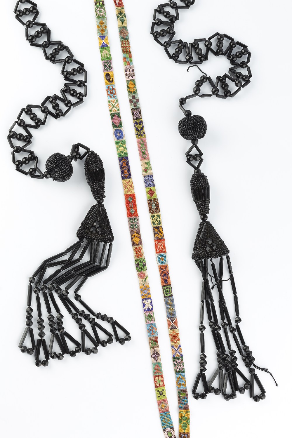 TWO BEADED SAUTOIR NECKLACES, circa 1920-30, the first a black beaded necklace with tassel drops, ( - Image 2 of 4
