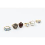 A COLLECTION OF GEM SET DRESS RINGS, comprising a sapphire tiered cluster ring, yellow precious