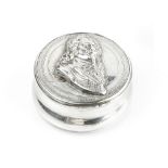 AN ANTIQUE SILVER CIRCULAR BOX, the hinged cover with relief portrait of Charles I, within
