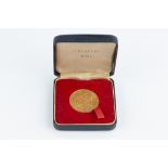 A REPUBLIC OF SINGAPORE GOLD $150 COIN, commemorating the 150th Anniversary of the founding of