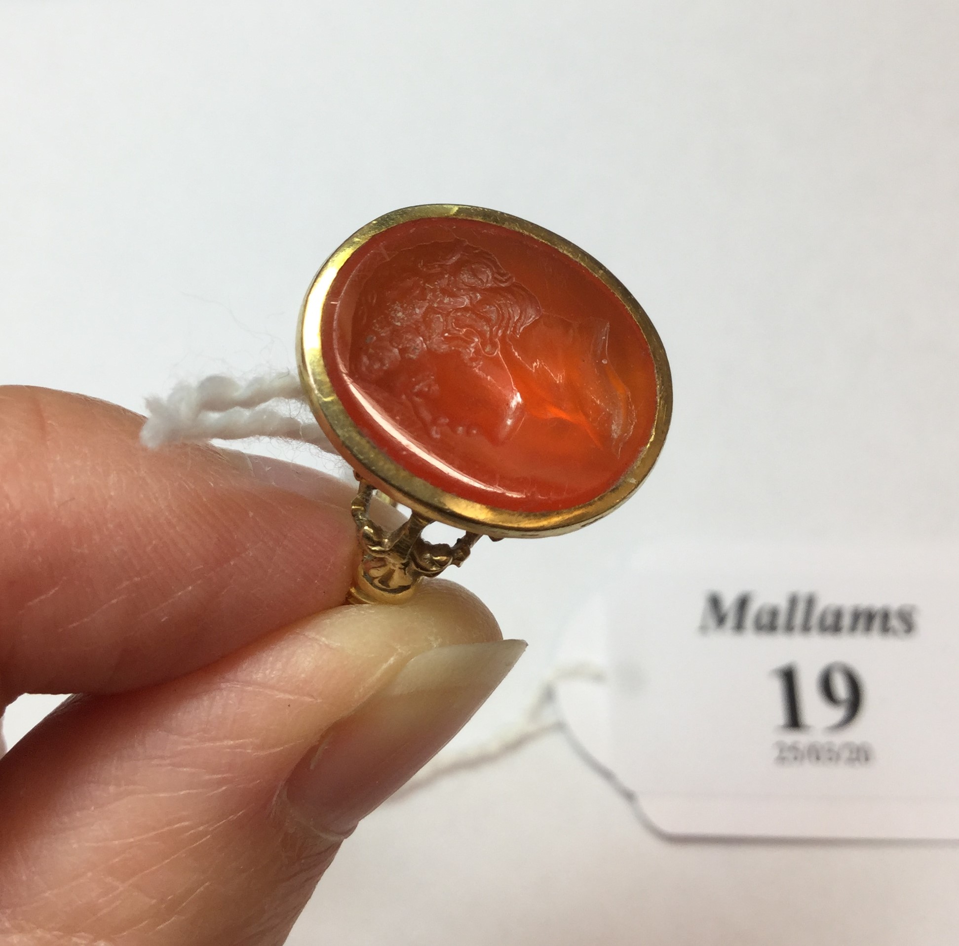 A 19TH CENTURY HARDSTONE INTAGLIO RING, the oval cornelian panel incised with a classical male - Image 2 of 7