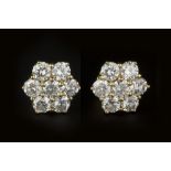 A PAIR OF DIAMOND CLUSTER EAR STUDS, each flowerhead cluster of round brilliant-cut diamonds in claw
