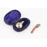 A LATE VICTORIAN SILVER GILT BABY'S RATTLE, engraved with birds and foliage, by William Summers,