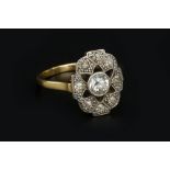A DIAMOND PANEL RING, the shaped oval panel centred with an old-cut diamond in collet setting,