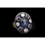 A SAPPHIRE, DIAMOND AND ENAMEL PANEL RING, the oval blue enamel panel centred with a cushion-