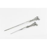 TWO GRADUATED LATE VICTORIAN SILVER GAME SKEWERS, each with pierced caduceus terminal, by James