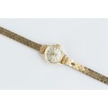 A LADY'S BRACELET WATCH, the circular silvered dial with baton markers, signed Oriosa, to a jewelled