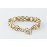 A 9CT GOLD GATE-LINK BRACELET, with padlock clasp, length 18cm