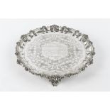 AN EARLY VICTORIAN SILVER SALVER, with foliate and scroll cast shaped border, engraved with stylised