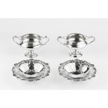 A PAIR OF EDWARDIAN SILVER SWEETMEAT BASKETS, with foliate pierced decoration, and shell and