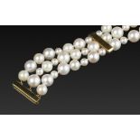 A CULTURED PEARL TRIPLE STRAND BRACELET BY FIONA RAE, comprising three strands of cultured pearls,