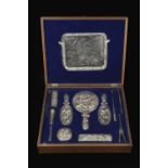 AN EARLY 20TH CENTURY CHINESE EXPORT SILVER DRESSING TABLE SET by Wang Hing, 1910, comprising a