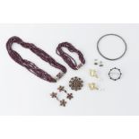 A COLLECTION OF JEWELLERY, comprising a multi-strand faceted bead necklace and bracelet suite, a