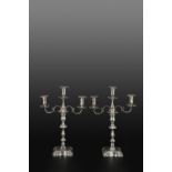 A PAIR OF WILLIAM IV SILVER CANDLESTICKS, with shaped and knopped stems, on shaped square bases,