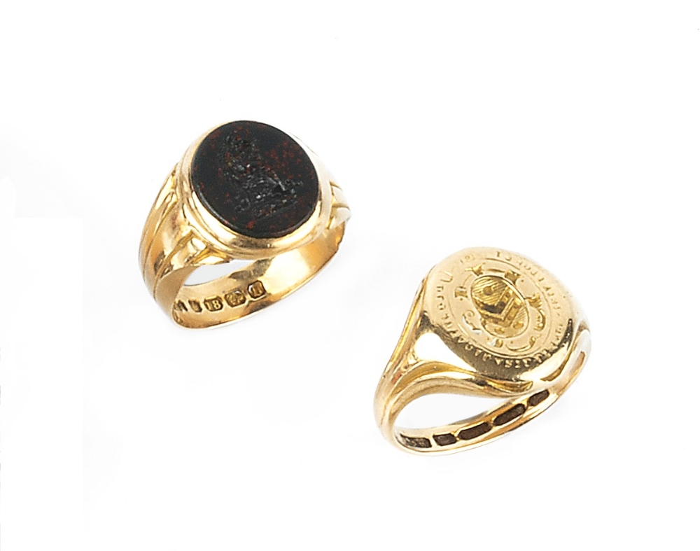 TWO VICTORIAN 18CT GOLD SIGNET RINGS, the first with incised armorial and motto, with reverse