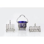 A SILVER SWING HANDLED SUGAR BASKET, with gadrooned border, the sides pierce decorated with stylised