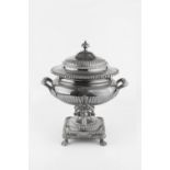 A MID 19TH CENTURY SILVER PLATED BALUSTER TEA URN AND COVER, with gadrooned borders, and twin reeded