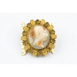 A 19TH CENTURY SHELL CAMEO CLASP, the oval shell cameo carved to depict a classical female