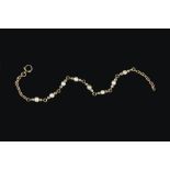 A PEARL AND DIAMOND BRACELET, the trace-link bracelet spaced with trios of pearls and rose-cut