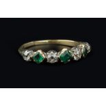 A 19TH CENTURY EMERALD AND DIAMOND HALF HOOP RING, alternately set with step-cut emeralds and old-