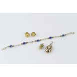 AN ENAMEL AND CULTURED PEARL BRACELET BY UNOAERRE, comprising a line of blue enamel ovoid beads,