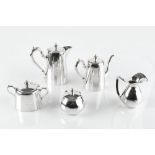 A PERUVIAN SILVER THREE PIECE TEA SERVICE comprising teapot, hot water pot and sucrier, together
