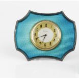 A SILVER AND TURQUOISE ENAMEL EASEL TIMEPIECE, of shaped outline, with circular gilt dial, by