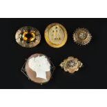 A COLLECTION OF VICTORIAN AND LATER BROOCHES, comprising a citrine single stone panel brooch, (later